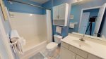 Guest bathroom with single sink basin and tub/shower combo 